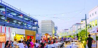 People are seen eating at a food park behind a mall in Iloilo City. MARCO VERCH
