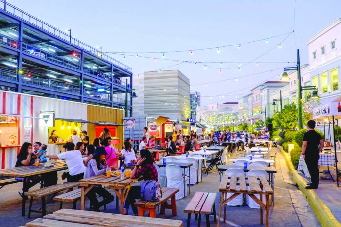 A local food park behind a mall in Iloilo People are seen eating at a food park behind a mall in Iloilo City. MARCO VERCH