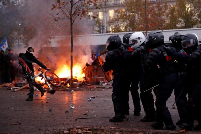 French police fire tear gas at strikers challenging reform French CRS riot police face off with protesters during clashes at a demonstration against the government’s pensions reform plans in Paris, France on Dec. 5. REUTERS/GONZALO FUENTES