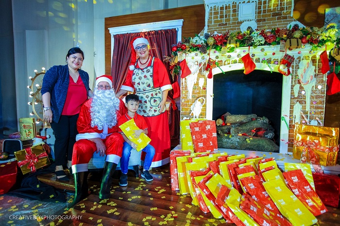 Ms. Jennifer Fong and son, Jake Fong together with Mr. and Mrs. Claus