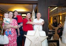 Iloilo City mayor Jerry Treñas and businessman Alfonso Tan lead the ceremonial switching on of Hotel Del Rio’s festive lights.
