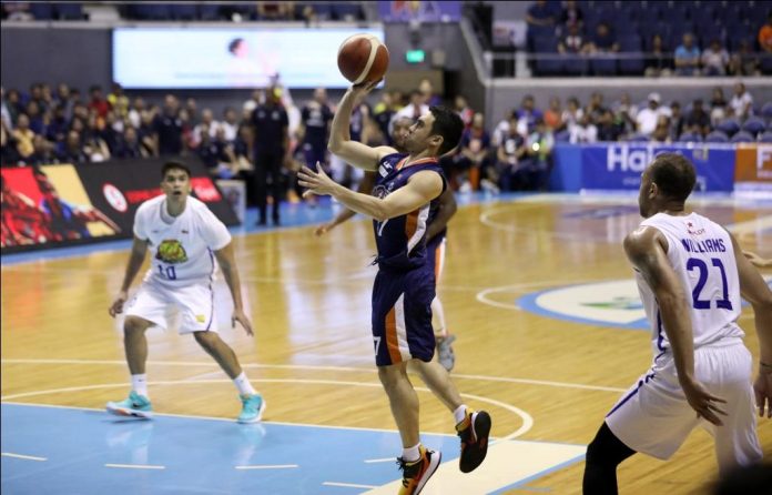 Ilonggo Anjo Caram of Meralco Bolts leaves the TNT Katropa’s defense for a floater. PBA PHOTO