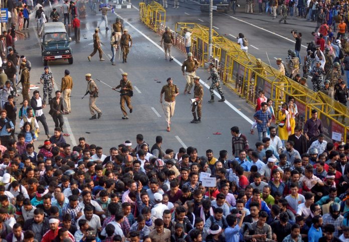 India’s citizenship law sparks protests Police chase away demonstrators during a protest in Guwahati, India on Dec. 11. REUTERS/ANUWAR HAZARIKA