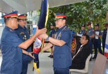 ‘Serve like superheroes,’ Capiz cops told Incoming acting provincial director Colonel Julio Gustilo Jr. (left) receives a symbol of the Capiz Police Provincial Office from Police Regional Office-6 director Brigadier General Rene Pamuspusan during a turnover of command ceremony at the Camp Teodorico C. Apil in Barangay Lanot, Roxas City, Capiz on Dec. 2. PIA CAPIZ PHOTO/A. LUMAQUE