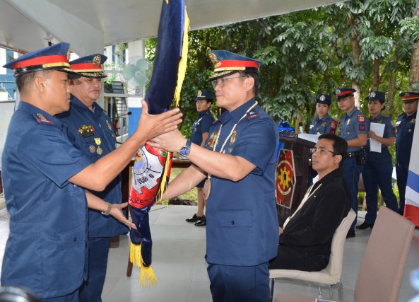 Incoming acting provincial director Colonel Julio Gustilo Jr. (left) receives a symbol of the Capiz Police Provincial Office from Police Regional Office-6 director Brigadier General Rene Pamuspusan during a turnover of command ceremony at the Camp Teodorico C. Apil in Barangay Lanot, Roxas City, Capiz on Dec. 2. PIA CAPIZ PHOTO/A. LUMAQUE