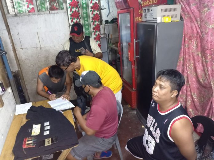 Junel Salazar Antidrug operatives inspect items seized from “high-value” suspect Junel Salazar during an entrapment operation in Barangay 6, Bacolod City on Dec. 28. POLICE STATION 3/BCPO