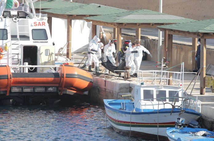 Lampedusa shipwreck death toll rises to 18 Italian coastguards carry the body of a migrant victim of a boat that capsized off the Italian coast, on the island of Lampedusa, Italy on Nov. 30. REUTERS/MAURO BUCCARELLO