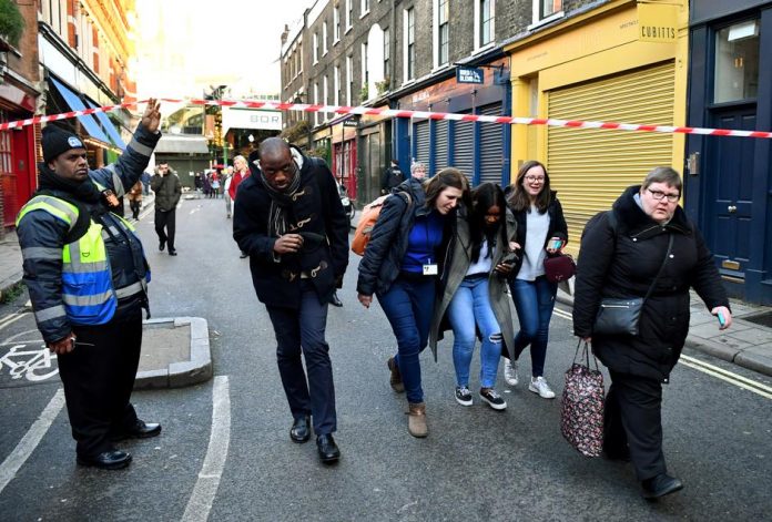London killer shot dead People leave the area near Borough Market after an incident at the bridge in London, Britain on Nov. 29. REUTERS/DYLAN MARTINEZ