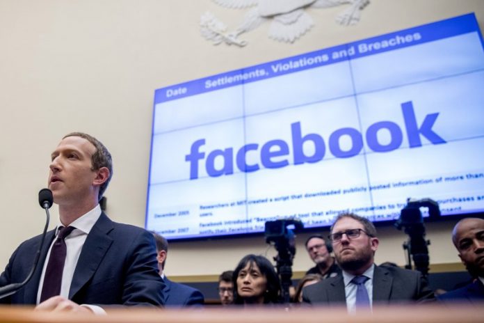 Facebook chief executive officer Mark Zuckerberg testifies before a House Financial Services Committee hearing on Capitol Hill in Washington. Facebook’s stock dropped almost three percent in regular trading after news reports suggested that the Federal Trade Commission may take antitrust action to prevent Facebook from integrating its disparate messaging apps. ANDREW HARNIK/AP