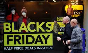 Online Black Friday sales People walk past a sign advertising Black Friday offers in the window of a Blacks outdoor clothing store in Manchester, Britain Nov. 22, 2019. PHIL NOBLE/REUTERS