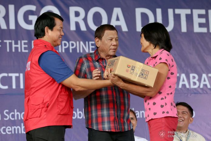 President Rodrigo Duterte President Rodrigo Duterte distributes relief packs to residents in North Cotabo still reeling from the impact of earthquakes that jolted Mindanao recently. Duterte also led the 123rd Rizal Day rites in Davao City on Monday. PCOO