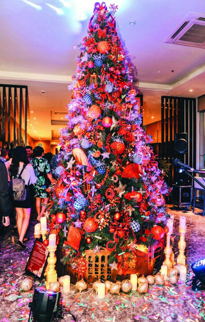 Seda Atria lit up in classic Christmas colors of red, gold, black, and green
