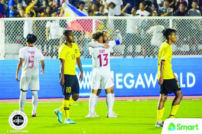 Stephan Schrock Stephan Schrock is hugged by a teammate after scoring a goal against Malaysia. TIEBREAKER TIMES PHOTO