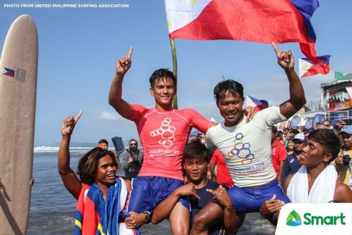 Surfer Roger Casugay Surfer Roger Casugay celebrates with teammates after winning gold in the Southeast Asian Games.