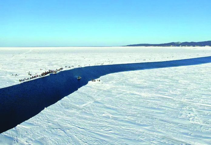 536 fishermen rescued from giant ice floe A group of fishermen use a smaller piece of ice as a raft trying to row to the coast, as the ice floe with stranded fishermen on them slowly drifted further away from the land in eastern Siberia, Russia in this Jan. 28, 2020 photo. RUSSIA EMERGENCY SITUATIONS MINISTRY PRESS SERVICE VIA AP