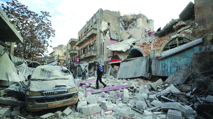 Airstrike in Idlib Syrian walks on the rubble of a building following an airstrike in Idlib on Jan. 15,2020. AFP