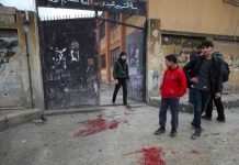 Artillery fire kills 9 in Syria The school in Sarmin was run by the United Kingdom-based humanitarian organization Syria Relief. It was sheltering displaced people when cluster munitions hit the school on Wednesday, according to authorities. AFP
