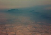 Smoke and haze over mountains are seen from a No 11 Squadron P-8A Poseidon conducting damage assessment and surveillance in the bushfire-affected area near Cooma, New South Wales, Australia on Jan. 7. SGT MURRAY STAFF/AUSTRALIAN DEPARTMENT OF DEFENCE/HANDOUT VIA REUTERS