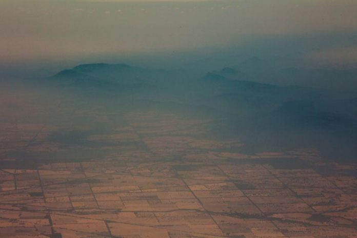 Australia issues new evacuation alerts Smoke and haze over mountains are seen from a No 11 Squadron P-8A Poseidon conducting damage assessment and surveillance in the bushfire-affected area near Cooma, New South Wales, Australia on Jan. 7. SGT MURRAY STAFF/AUSTRALIAN DEPARTMENT OF DEFENCE/HANDOUT VIA REUTERS