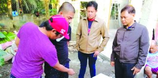 Antidrug operatives frisk one of the suspects nabbed in a drug buy-bust operation in Barangay Banago, Bacolod City on Jan. 21. CDEU/BCPO