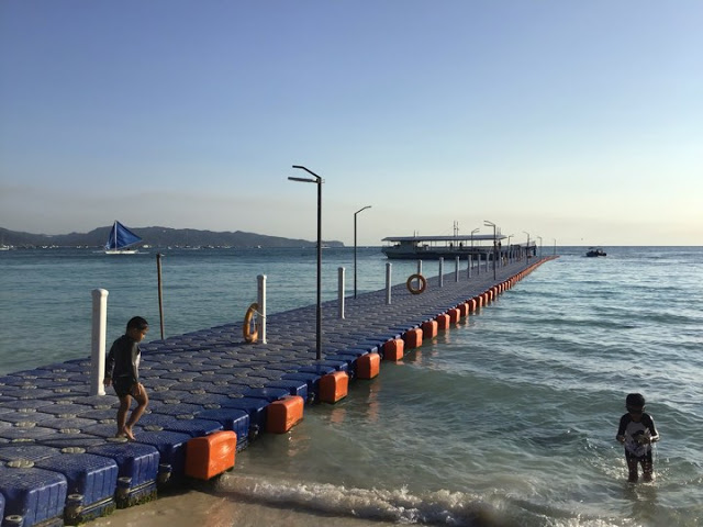 The blue pontoon, measuring about 100 meters from the shoreline, is built near the boat stations in White Beach, Boracay Island, Malay, Aklan. Recently, the National Task Force Boracay ordered acting Malay mayor Frolibar Bautista to stop collecting pontoon fees amid mounting complaints. AKEAN FORUM