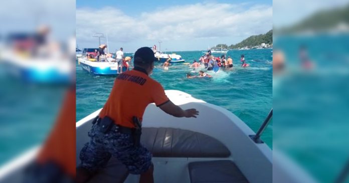 TOURISTS IN TROUBLE. Rescuers from the Philippine Coast Guard and concerned motorboats help the passengers of a boat that capsized in the waters of Boracay Island on Jan. 21, 2020. The police of Malay, Aklan has launched an investigation. Among others, it wants to determine if the ill-fated boat had lifejackets for passengers. PHILIPPINE COAST GUARD PHOTOS