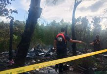 Officers of the Bureau of Fire Protection check the remains of houses destroyed after fire hit Barangay Cagbang, Oton, Iloilo on Jan. 3. IAN PAUL CORDERO/PN
