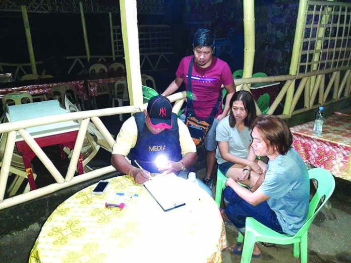Buy-bust nets 2 drug suspects An antidrug officer inspects items seized from Angielyn Marba and Andrew Delasan. Marba and Delasan were nabbed in an entrapment operation in Barangay Punta Taytay, Bacolod City. POLICE STATION 9/ BCPO