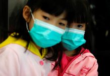 China locks down city amid virus outbreak Children wear masks at the Hong Kong West Kowloon High Speed Train Station, in Hong Kong, China on Jan. 23. REUTERS/TYRONE SIU