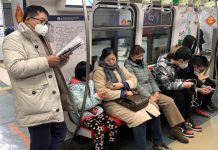 China reports 4th death from new coronavirus A man wearing a mask reads on the subway in Beijing, China on Jan. 21. REUTERS/TINGSHU WANG