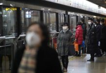China virus death toll mounts to 25 People wearing protective masks are seen at a subway station in Shanghai, China on Jan. 23. REUTERS/ALY SONG