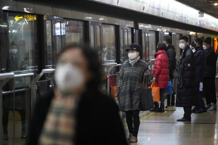 People wearing protective masks are seen at a subway station in Shanghai, China on Jan. 23. REUTERS/ALY SONG