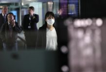 China virus death toll rises to 9; US reports first case A woman with mask passes by thermal screening point at the international arrival terminal of Kuala Lumpur International Airport in Sepang, Malaysia on Jan. 21. REUTERS/LIM HUEY TENG