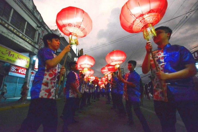 A lantern parade at dusk kicks off the weeklong Chinese New Year celebration in Iloilo City on Jan. 27. This afternoon, Jan. 29, there will be a grand parade downtown followed by a cultural show and fireworks display. IAN PAUL CORDERO/PN