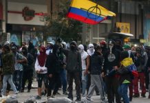 Colombian police clash with protesters Demonstrators take part in a protest against the government of Colombian President Ivan Duque, in Bogota, Colombia on Jan. 21. REUTERS/LUISA GONZALEZ