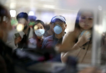 Chinese nationals arriving from Guangzhou, China are seen wearing face mask at the arrival area of Ninoy Aquino International Airport Terminal 1 on Wednesday, January 22, 2020 in Pasay City. 📸 Richard Reyes/Philippine Daily Inquirer