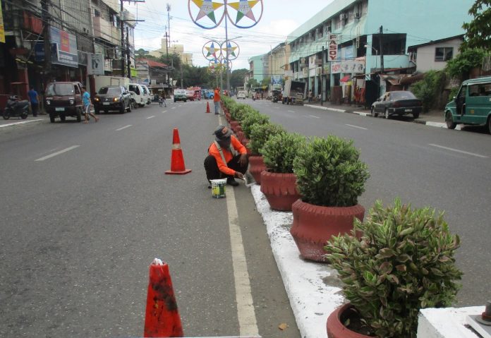 Personnel of the DPWH Iloilo City District Engineering Office undertaking maintenance activities along major roads in city proper area in preparation for Dinagyang Festival 2020. DPWH ILOILO CITY DEO