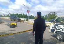 Cop in twin slays want to be state witness CRIME SCENE. A police officer secures the spot where motorcycle-driving businessman Delfin Britanico was ambushed in Barangay Nabitasan, La Paz, Iloilo City on Jan. 19. 2020. The victim’s family believes the attack is business-related, according to the Iloilo City Police Office. IAN PAUL CORDERO/PN