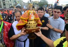 DINAGYANG 2020: Festival of Ilonggo faith Reverend Father Edcel Alcayaga of the Parish of San Jose de Placer and Mayor Jerry Treñas of Iloilo City carry the Señor Santo Niño for a foot procession after the fluvial parade at the Iloilo River.