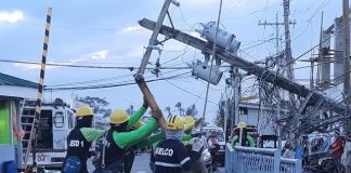 Linemen from various electric cooperatives fix a pole damaged during the onslaught of typhoon “Ursula.” According to a report, over 850 electric posts were toppled by the typhoon in the franchise area of the Aklan Electric Cooperative. AKELCO