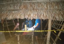 Drug suspect Hazel Joy Villavert sits handcuffed after police officers arrest her in an entrapment operation at a bar in Culasi, Antique on Jan. 16. STEPHEN LOUIE CHECA/PN