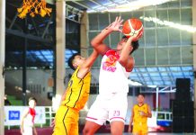 NBTC: Hua Siong drubs Assumption for first win Hua Siong College of Iloilo Red Phoenix’s Reneil Gamboa scores against an Assumption School Passi City player. WINMEL LEE