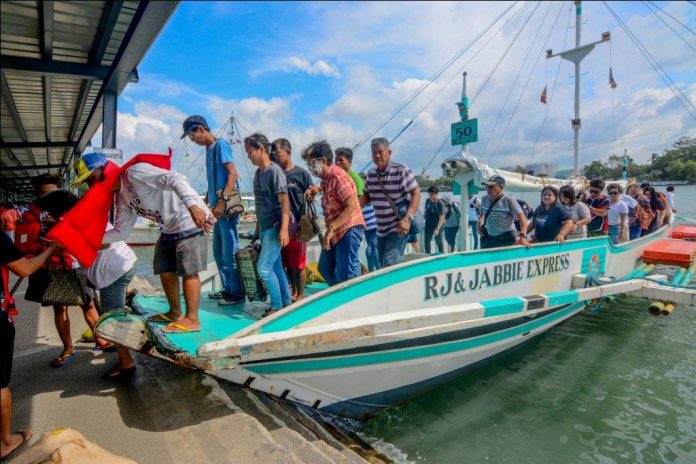 Iloilo Ferry Terminal-Parola Iloilo City People from Guimaras disembark from a motorboat at the Iloilo Ferry Terminal-Parola in Iloilo City. A proposed bridge connecting Panay (Iloilo City) and Guimaras, if realized, would be another travel option when crossing the Iloilo Strait to go to any point in the nearby island province from Iloilo City. It could curb if not totally eliminate fatal sea mishaps. IAN PAUL CORDERO/PN
