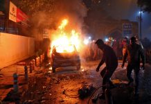 Indian citizenship law protests kill 6 persons Men try to extinguish a burning car after demonstrators set it on fire during a protest against a new citizenship law in New Delhi, India on Dec. 20, 2019. REUTERS/STRINGER