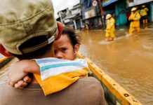 Indonesia flood death toll rises to 21 A girl is carried by her father across floodwaters in Jakarta, Indonesia on Jan. 2. WILLY KURNIAWAN/REUTERS