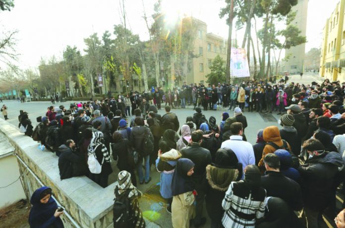 Iranian students gather for a demonstration over the downing of a Ukrainian airliner at Tehran University on Tuesday, in a fourth day of protests in the capital
