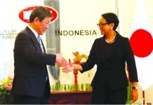 Japanese Foreign Minister Toshimitsu Motegi shakes hands with Indonesia's Foreign Minister Retno Marsudi during a meeting in Jakarta, Indonesia, January 10, 2020. REUTERS