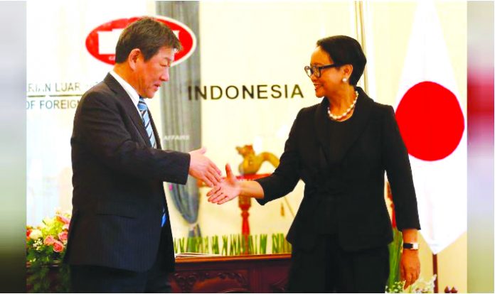 Japanese Foreign Minister Toshimitsu Motegi shakes hands with Indonesia's Foreign Minister Retno Marsudi during a meeting in Jakarta, Indonesia, January 10, 2020. REUTERS