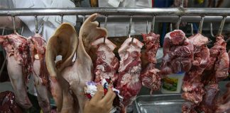 Meat is arranged at a public market stall in Antipolo City. A Philippine National Bank research warns Taal eruption could disrupt chicken and pork supply. ABS-CBN NEWS