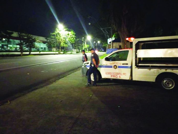 Policemen conduct mobile patrol in the boundary area and access road of Talisay City, Negros Occidental on Jan. 16. TALISAY CITY LGU